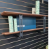 Wall mounted stylish shelf perfect for photos and books